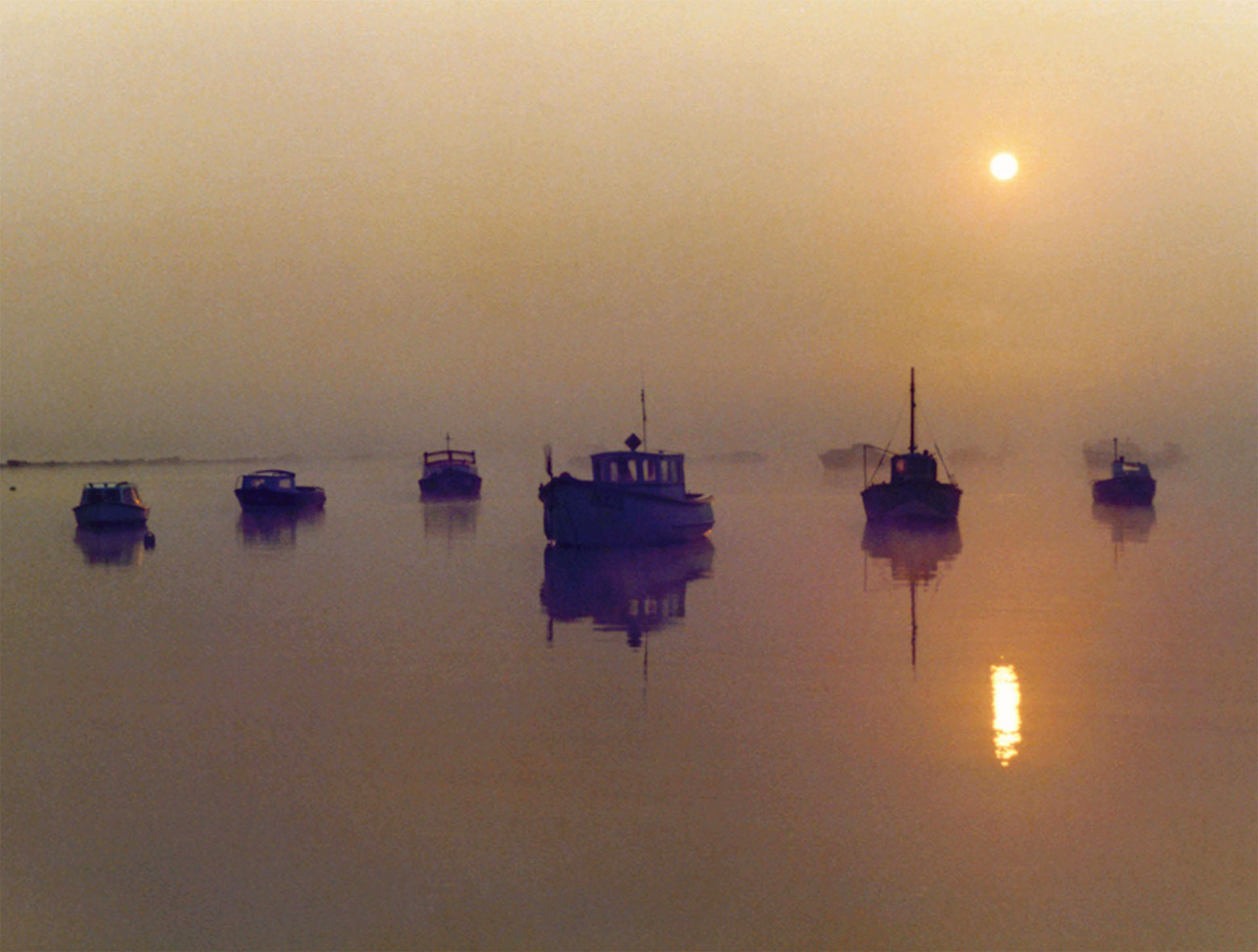 Sailing out of Bembridge Harbour early one summer morning, catching the tide. 